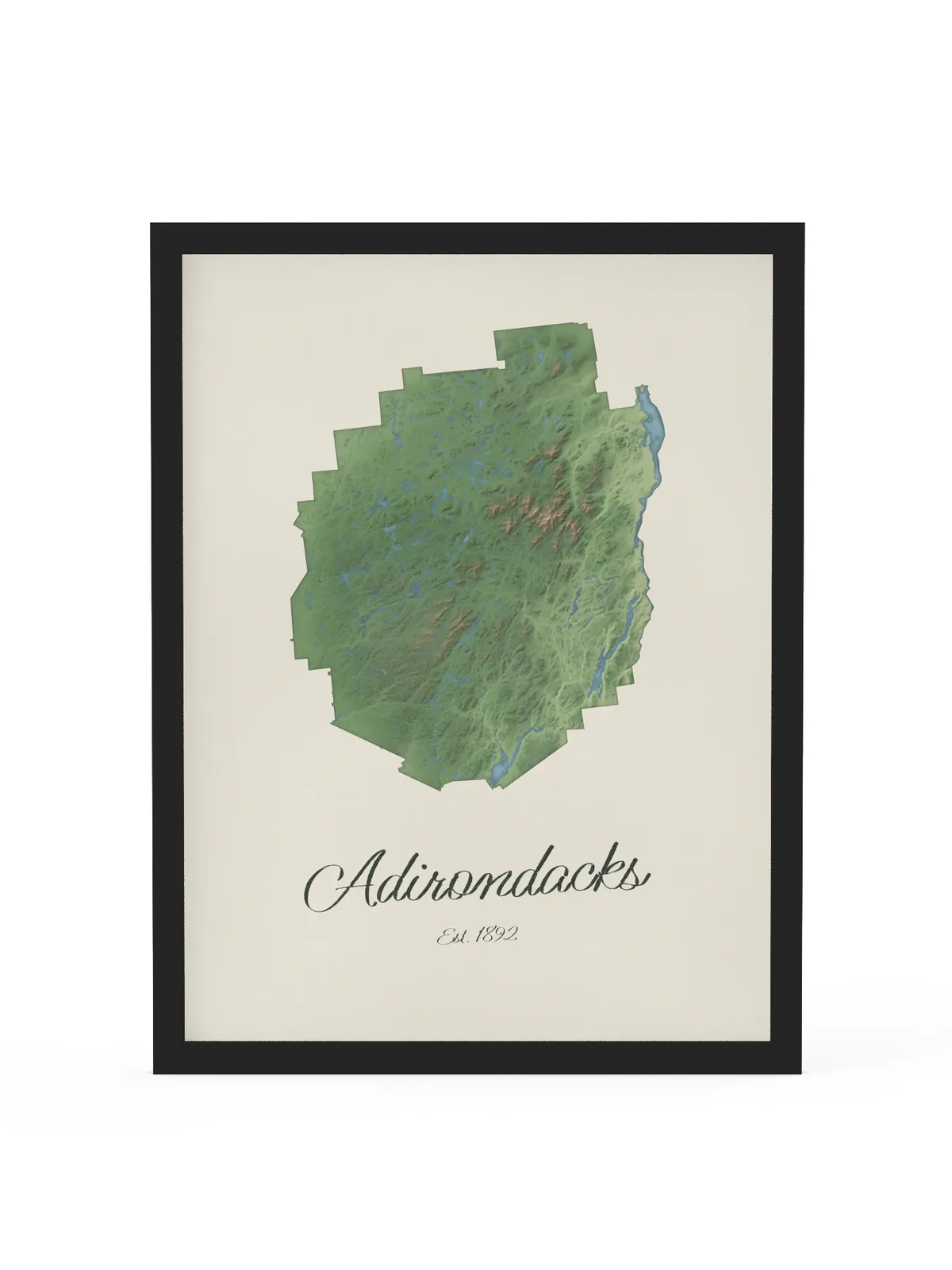 Adirondack Park Map as an 18 by 24 inch framed print in a black frame: a painted-style map of the Adirondack Park with its lakes, rivers and High Peaks in green on cream paper, with Adirondacks, Est. 1892 in dark green script below.