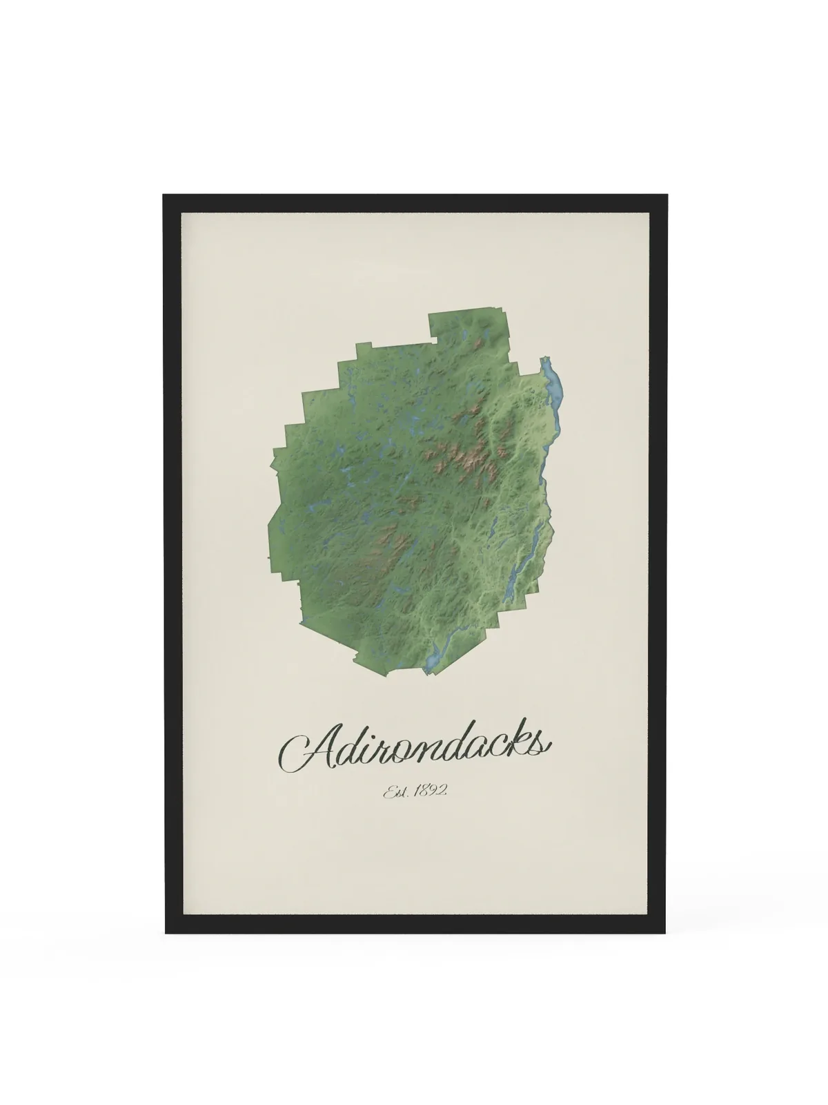 Adirondack Park Map as a 24 by 36 inch framed print in a black frame: a painted-style map of the Adirondack Park with its lakes, rivers and High Peaks in green on cream paper, with Adirondacks, Est. 1892 in dark green script below.