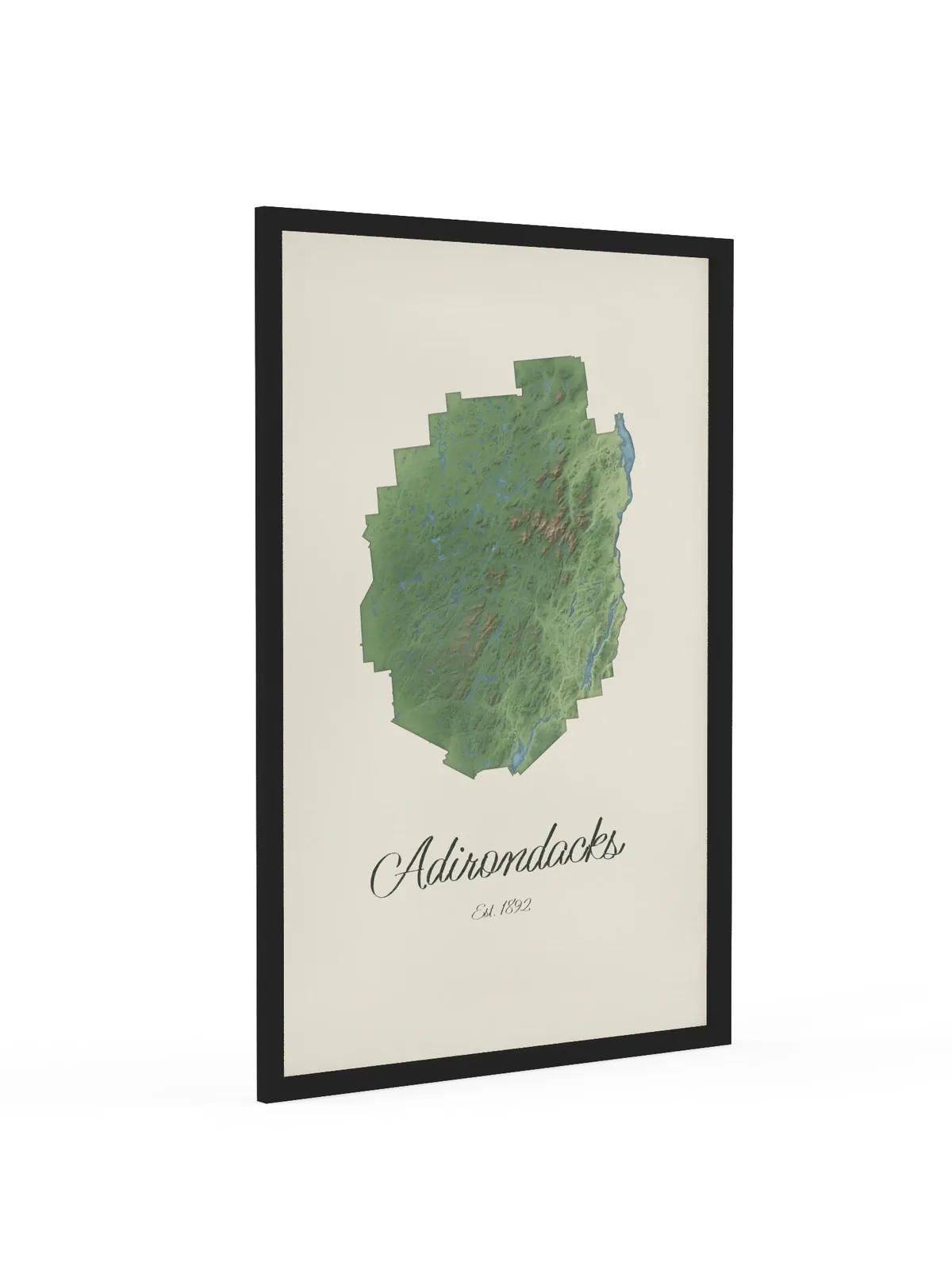 Adirondack Park Map as a 24 by 36 inch framed print in a black frame: a painted-style map of the Adirondack Park with its lakes, rivers and High Peaks in green on cream paper, with Adirondacks, Est. 1892 in dark green script below.