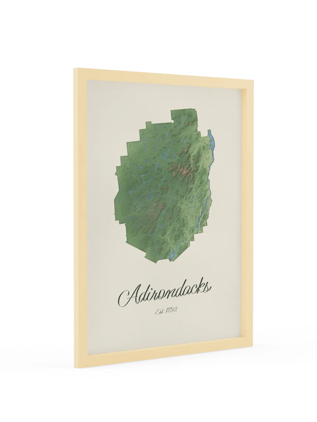 Adirondack Park Map as an 18 by 24 inch framed print in a natural wood frame: a painted-style map of the Adirondack Park with its lakes, rivers and High Peaks in green on cream paper, with Adirondacks, Est. 1892 in dark green script below.