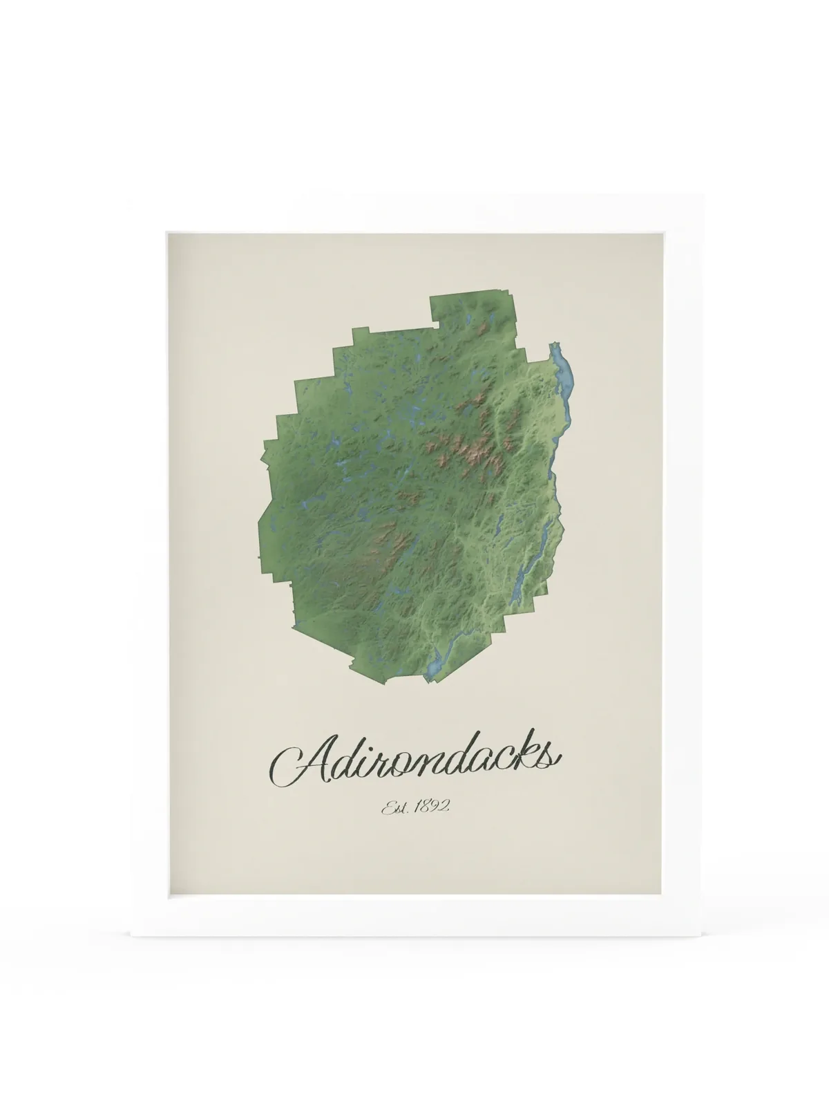 Adirondack Park Map as a 12 by 16 inch framed print in a white frame: a painted-style map of the Adirondack Park with its lakes, rivers and High Peaks in green on cream paper, with Adirondacks, Est. 1892 in dark green script below.