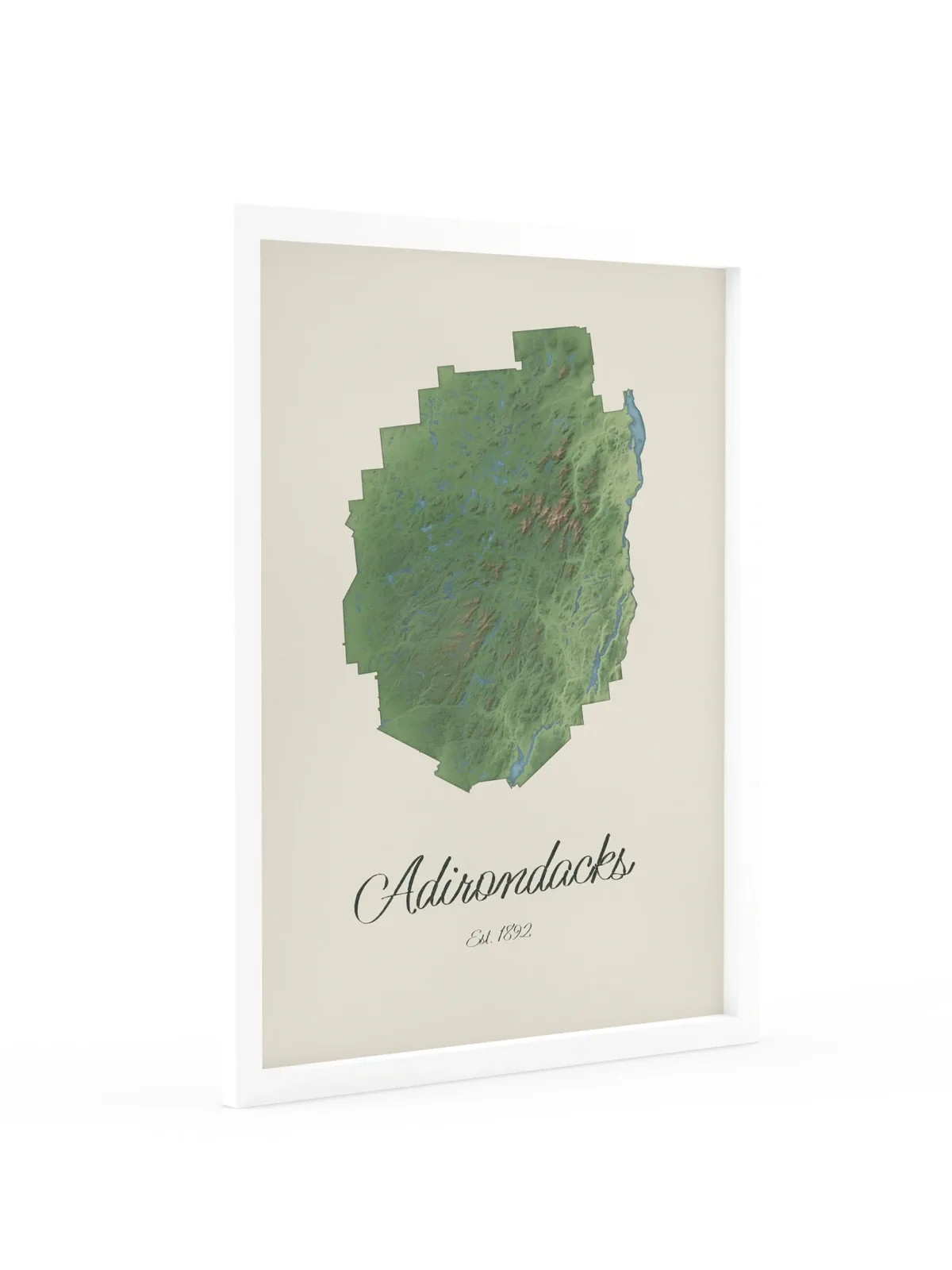 Adirondack Park Map as an 18 by 24 inch framed print in a white frame: a painted-style map of the Adirondack Park with its lakes, rivers and High Peaks in green on cream paper, with Adirondacks, Est. 1892 in dark green script below.