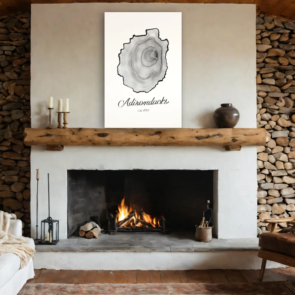 A 24 by 36 inch Ring & Ridge canvas leaning on a log mantel above a stone fireplace. Shown in a rendered room.