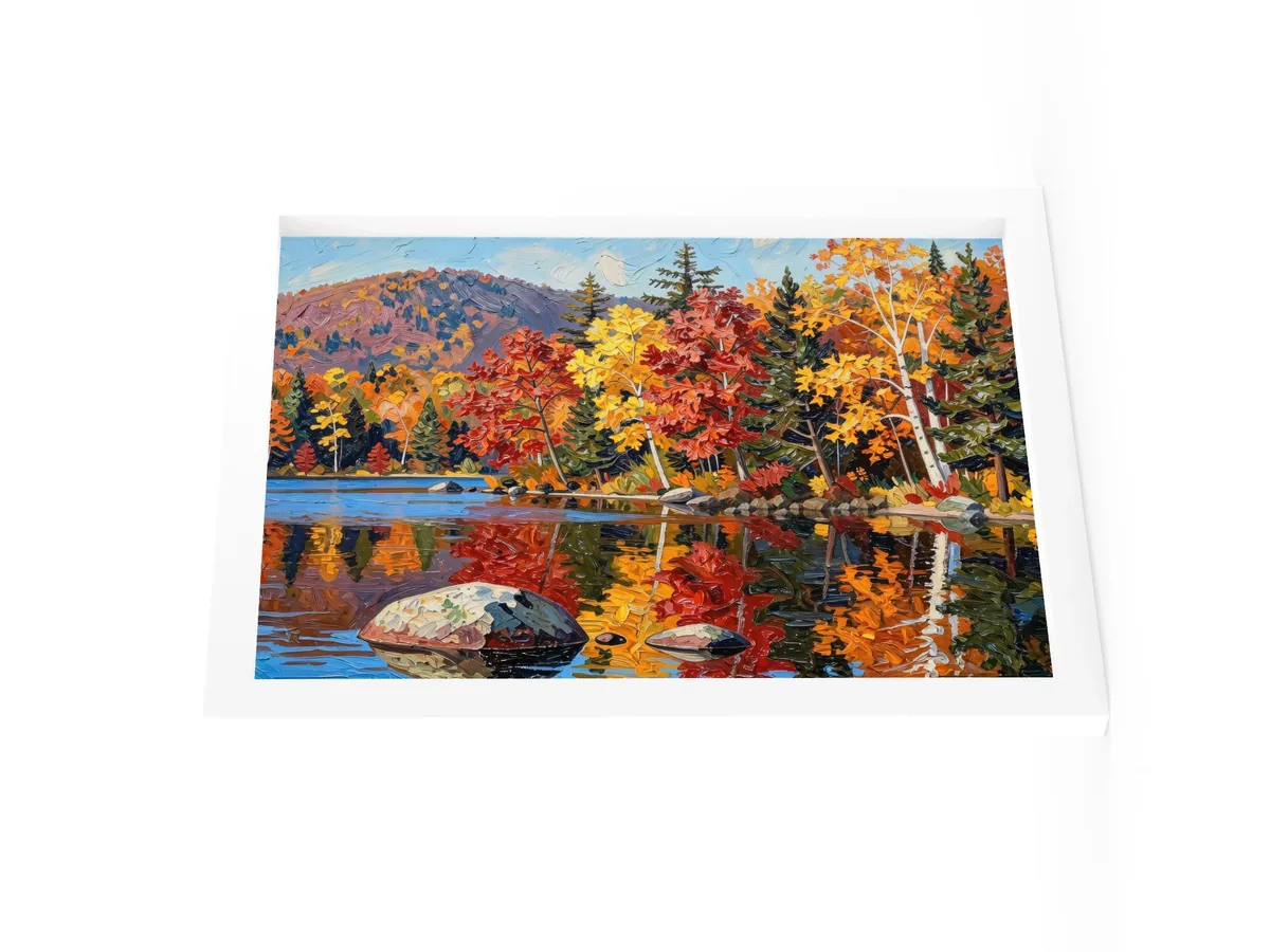 Autumn Shoreline as a 12 by 16 inch framed print in a white frame: red, orange and yellow fall trees and white birches along a calm lake, mirrored in the water, in bold oil-painting brushstrokes.