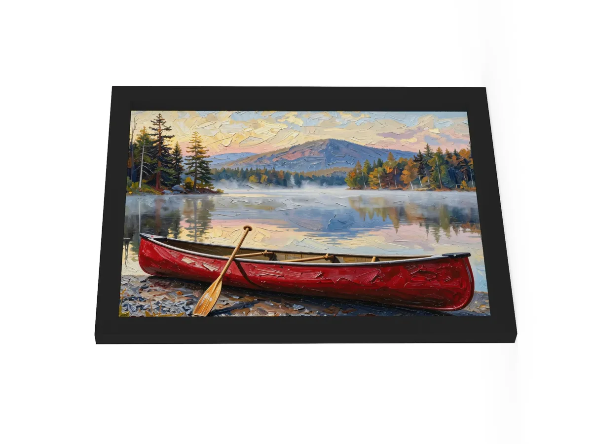 Canoe in Morning Mist as a 12 by 16 inch framed print in a black frame: a red wooden canoe with a paddle leaning on it, on a lakeshore as morning mist lifts off a calm Adirondack lake below a mountain, in bold oil-painting brushstrokes.