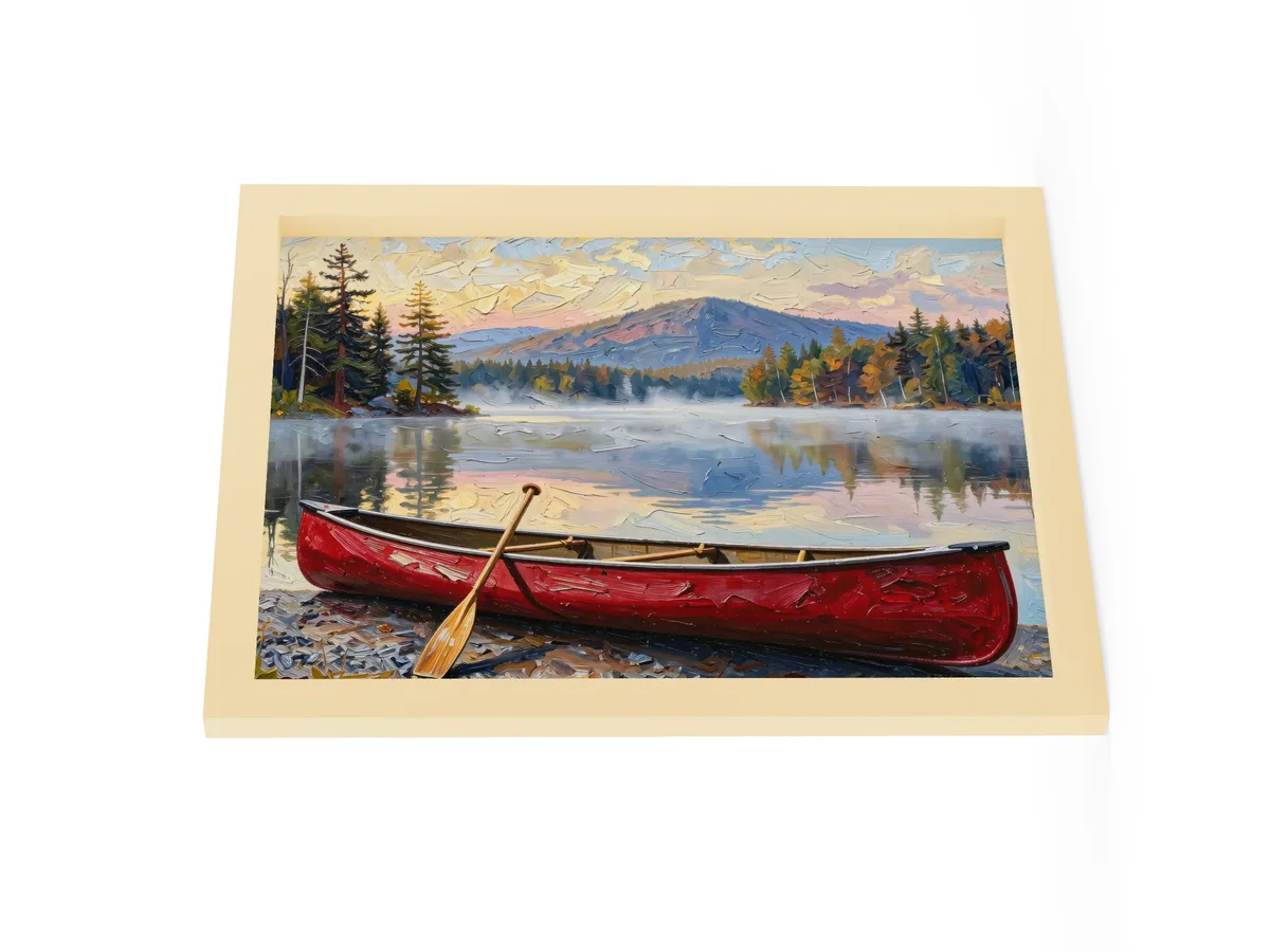 Canoe in Morning Mist as a 12 by 16 inch framed print in a natural wood frame: a red wooden canoe with a paddle leaning on it, on a lakeshore as morning mist lifts off a calm Adirondack lake below a mountain, in bold oil-painting brushstrokes.
