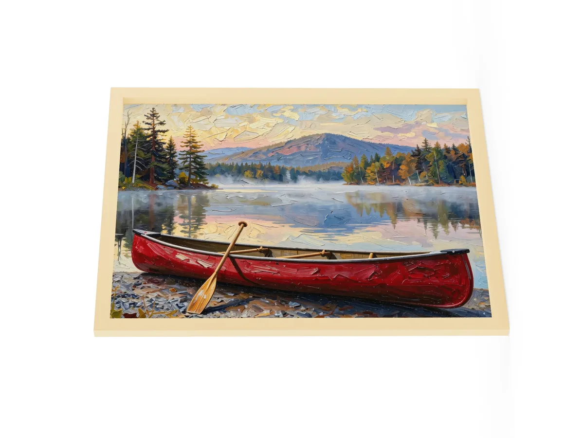 Canoe in Morning Mist as an 18 by 24 inch framed print in a natural wood frame: a red wooden canoe with a paddle leaning on it, on a lakeshore as morning mist lifts off a calm Adirondack lake below a mountain, in bold oil-painting brushstrokes.