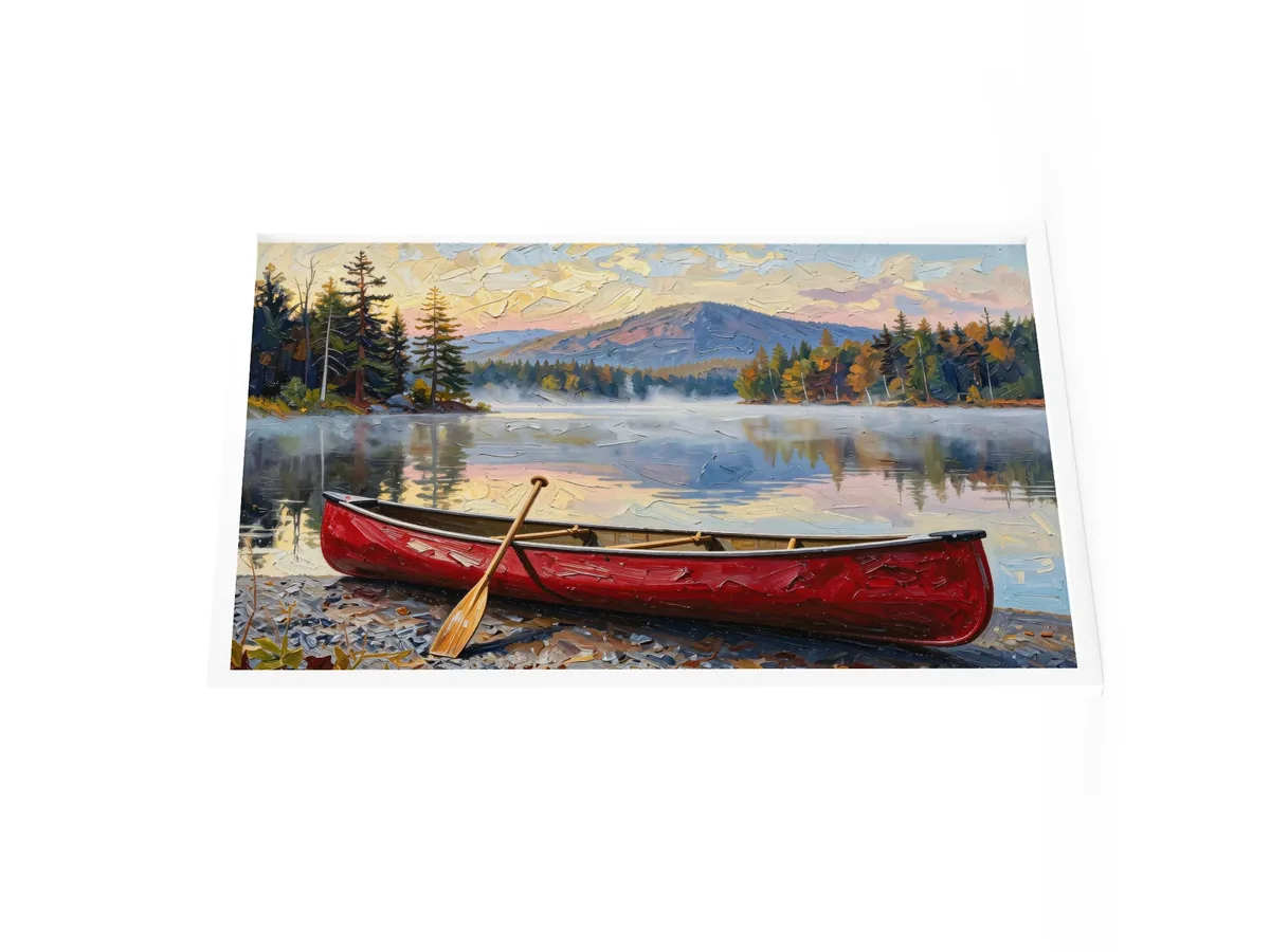 Canoe in Morning Mist as a 24 by 36 inch framed print in a white frame: a red wooden canoe with a paddle leaning on it, on a lakeshore as morning mist lifts off a calm Adirondack lake below a mountain, in bold oil-painting brushstrokes.