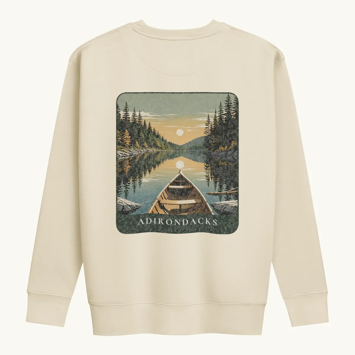 Canoe Sunset Crewneck in Bone, back: the bow of a wooden canoe on an Adirondack lake at sunset, Adirondacks.
