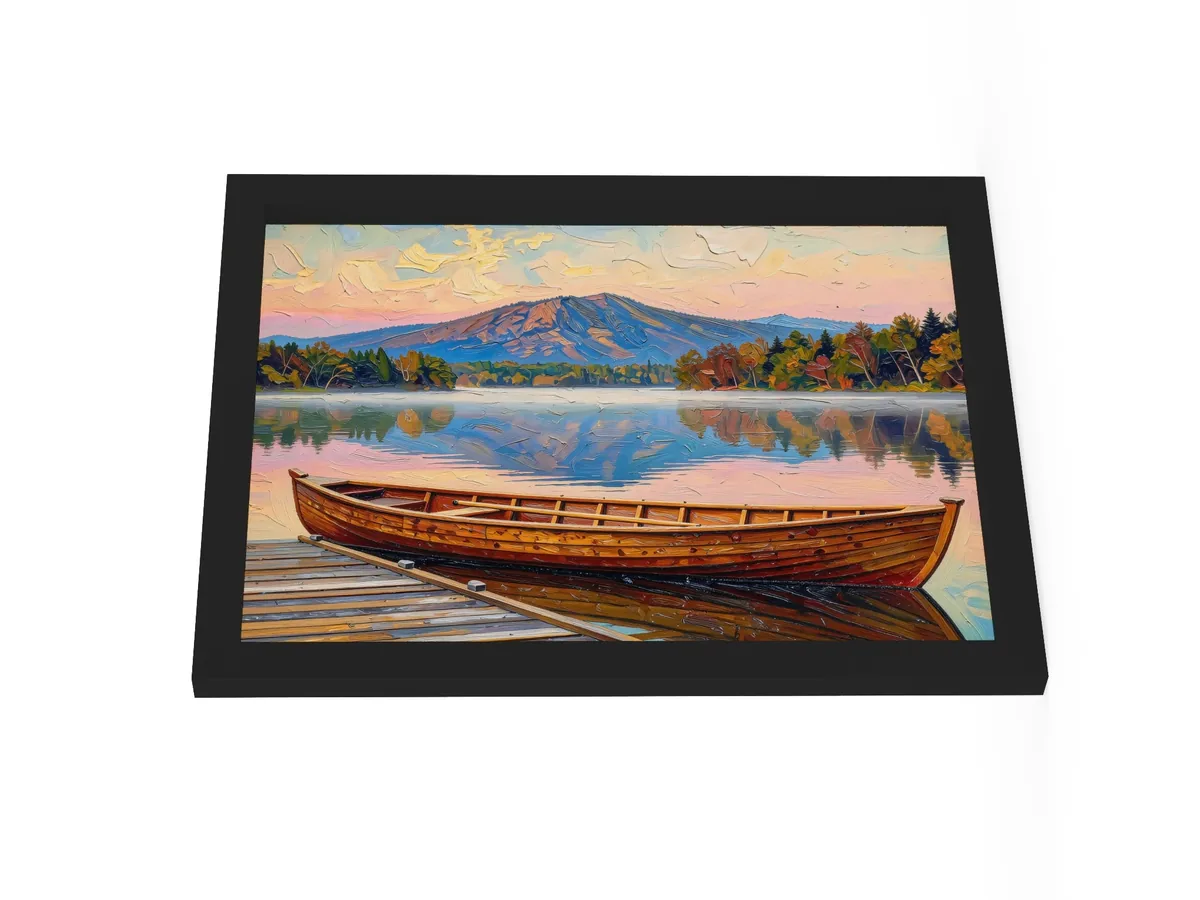 Guideboat at Dawn as a 12 by 16 inch framed print in a black frame: a varnished wooden Adirondack guideboat tied alongside a dock at dawn, with mist on a still lake and a mountain in pink light, in bold oil-painting brushstrokes.
