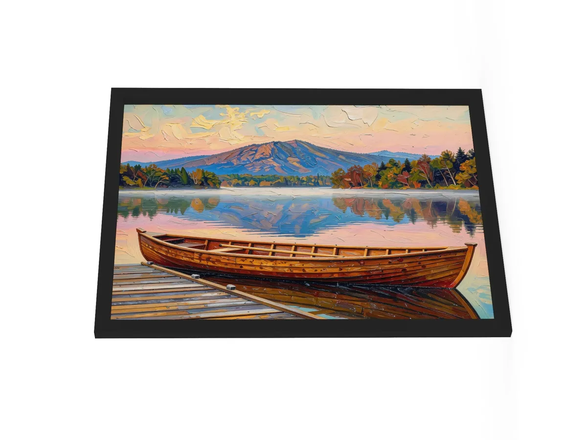 Guideboat at Dawn as an 18 by 24 inch framed print in a black frame: a varnished wooden Adirondack guideboat tied alongside a dock at dawn, with mist on a still lake and a mountain in pink light, in bold oil-painting brushstrokes.