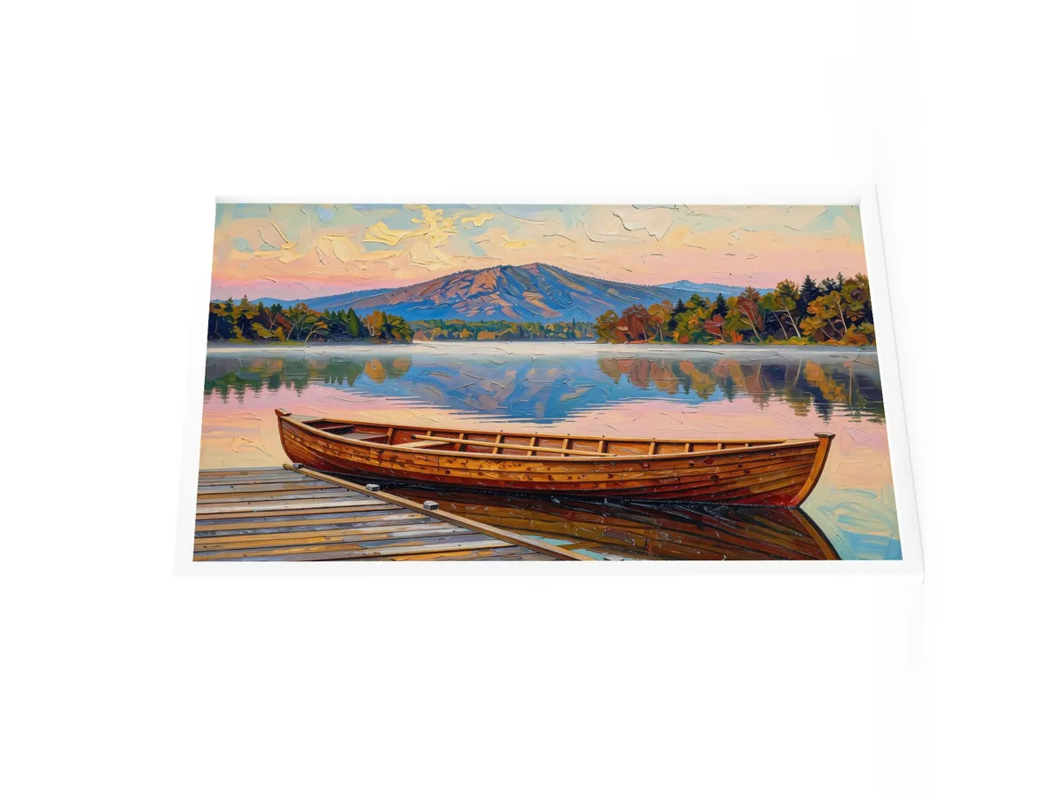Guideboat at Dawn as a 24 by 36 inch framed print in a white frame: a varnished wooden Adirondack guideboat tied alongside a dock at dawn, with mist on a still lake and a mountain in pink light, in bold oil-painting brushstrokes.