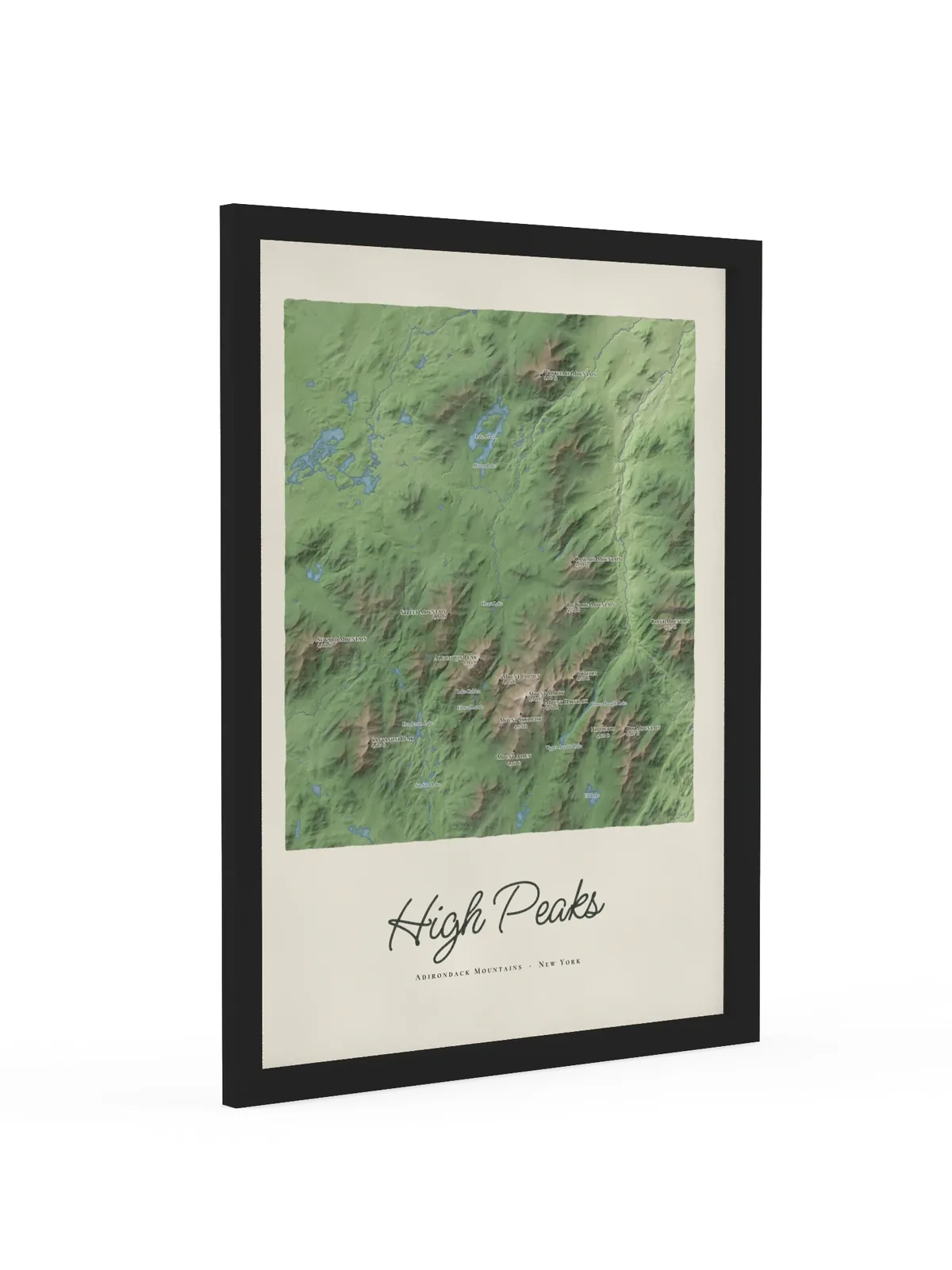 High Peaks Map as an 18 by 24 inch framed print in a black frame: a painted map of the Adirondack High Peaks with the summits shaded and sixteen peaks named with their heights, lakes and rivers in blue, with High Peaks lettered below in dark green script.
