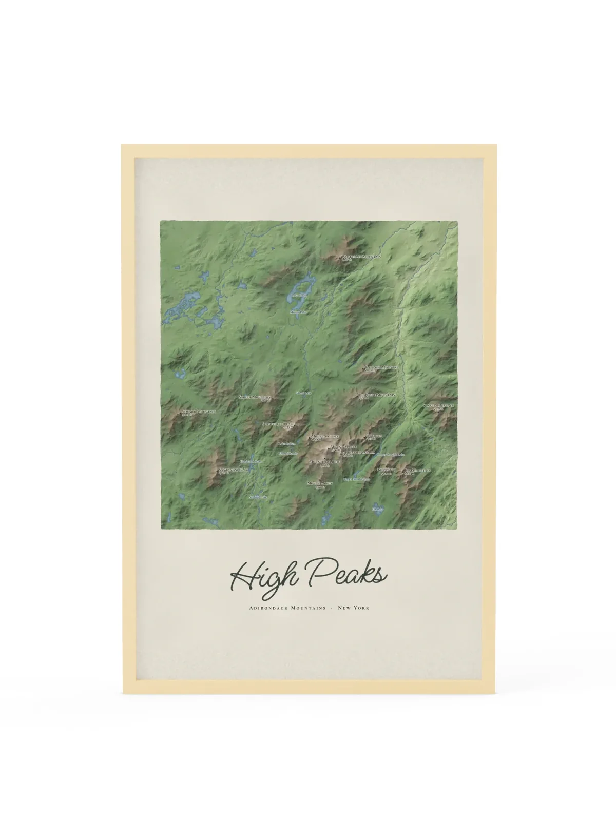 High Peaks Map as a 24 by 36 inch framed print in a natural wood frame: a painted map of the Adirondack High Peaks with the summits shaded and sixteen peaks named with their heights, lakes and rivers in blue, with High Peaks lettered below in dark green script.