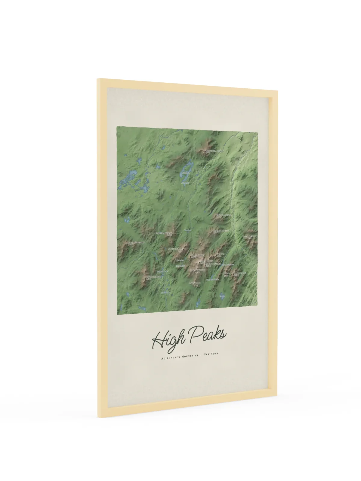 High Peaks Map as a 24 by 36 inch framed print in a natural wood frame: a painted map of the Adirondack High Peaks with the summits shaded and sixteen peaks named with their heights, lakes and rivers in blue, with High Peaks lettered below in dark green script.