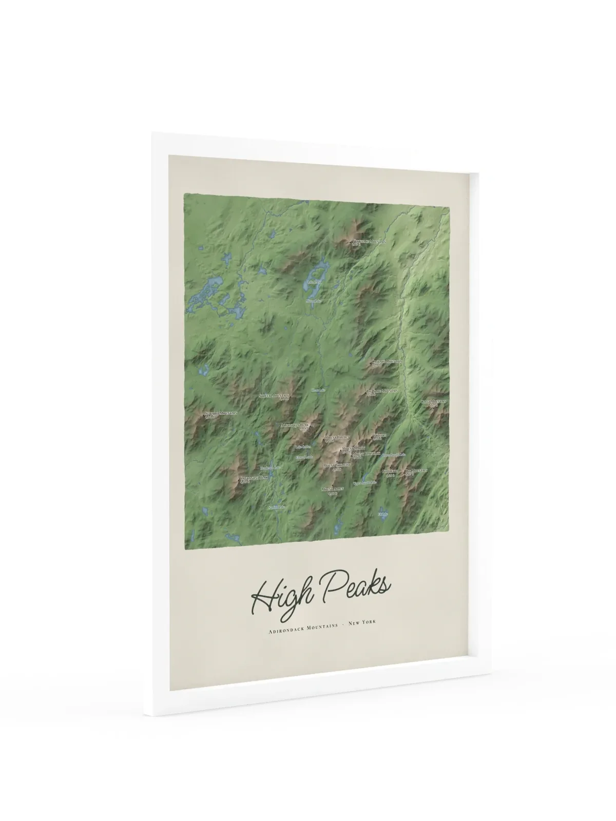 High Peaks Map as an 18 by 24 inch framed print in a white frame: a painted map of the Adirondack High Peaks with the summits shaded and sixteen peaks named with their heights, lakes and rivers in blue, with High Peaks lettered below in dark green script.