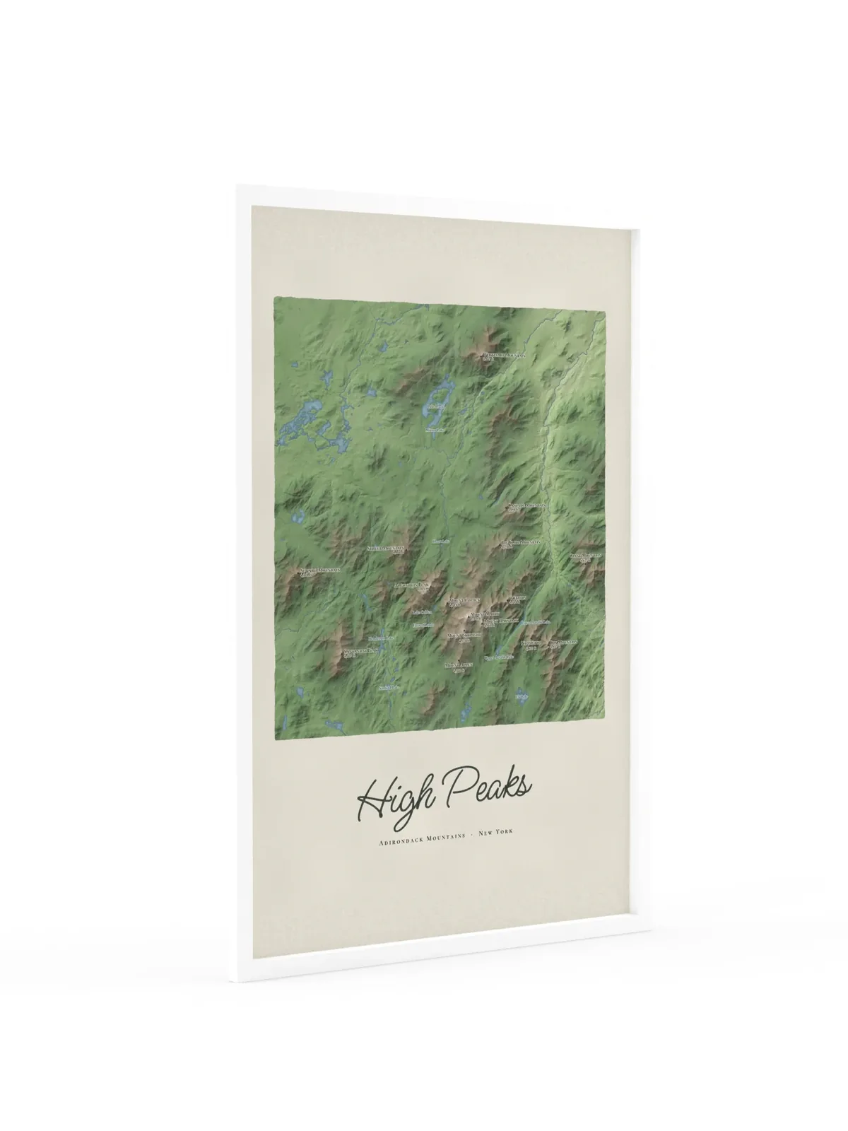 High Peaks Map as a 24 by 36 inch framed print in a white frame: a painted map of the Adirondack High Peaks with the summits shaded and sixteen peaks named with their heights, lakes and rivers in blue, with High Peaks lettered below in dark green script.