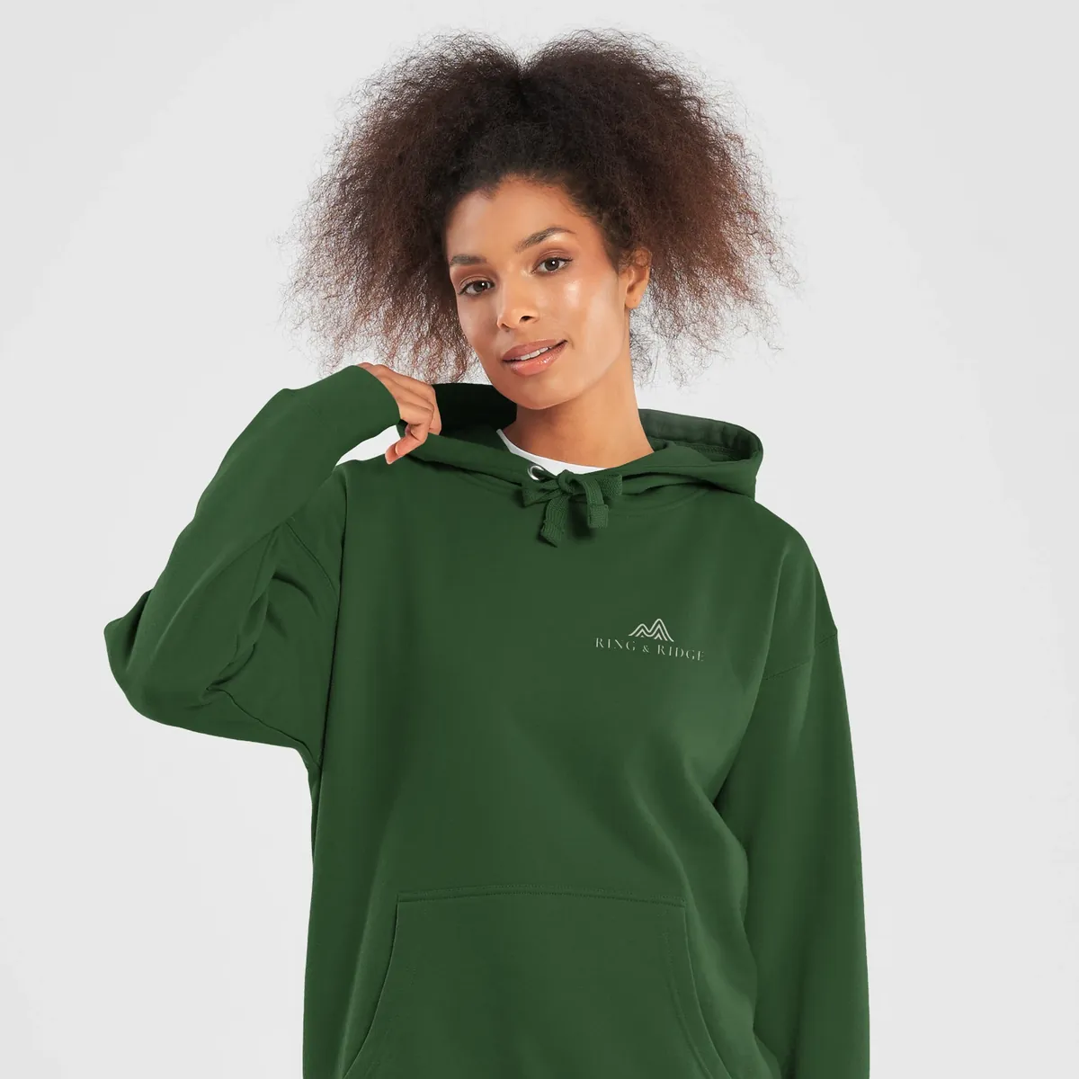Lakeside Campfire Hoodie in Forest Green, front: two Adirondack chairs by a lakeside campfire at dusk, Adirondacks, Est. 1892.