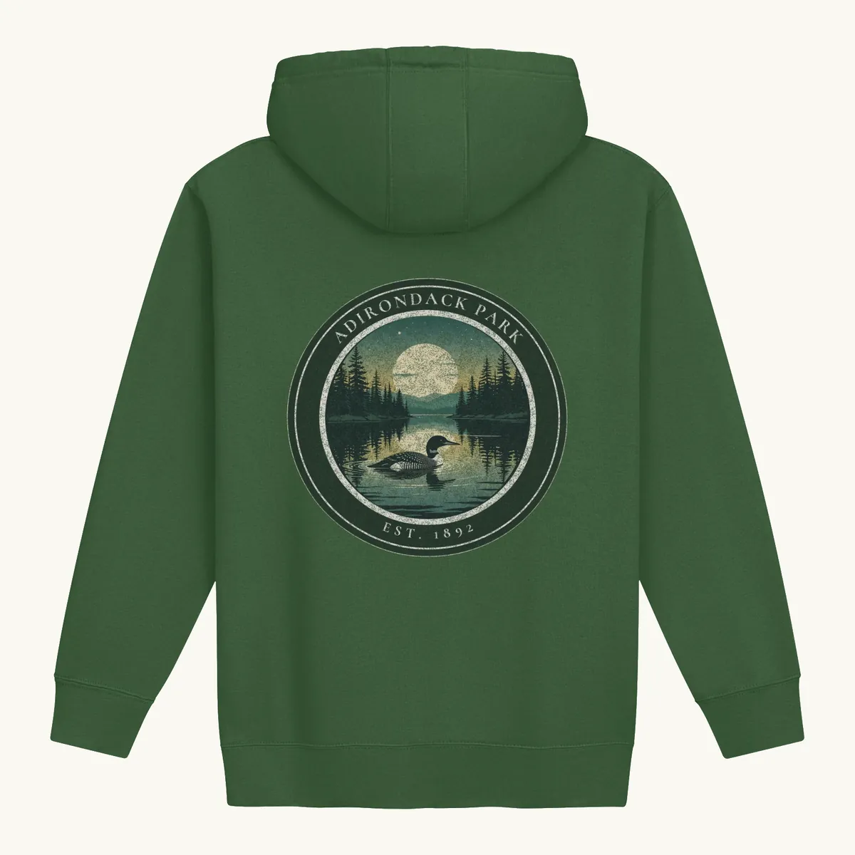 Loon at Night Hoodie in Forest Green, back: a loon on a moonlit Adirondack lake in a round badge, Adirondack Park, Est. 1892.