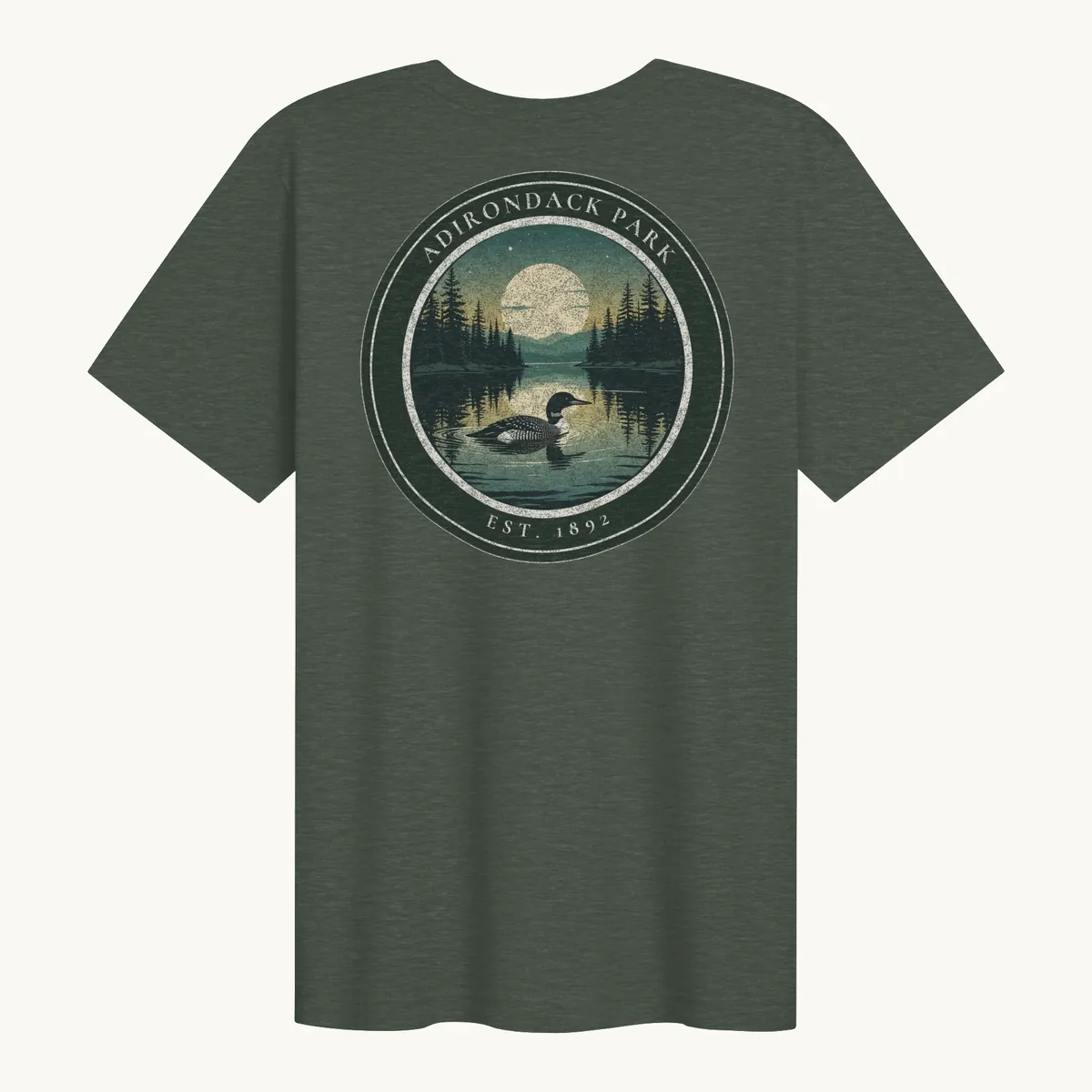 Loon at Night Tee in Heather Forest, back: a loon on a moonlit Adirondack lake in a round badge, Adirondack Park, Est. 1892.