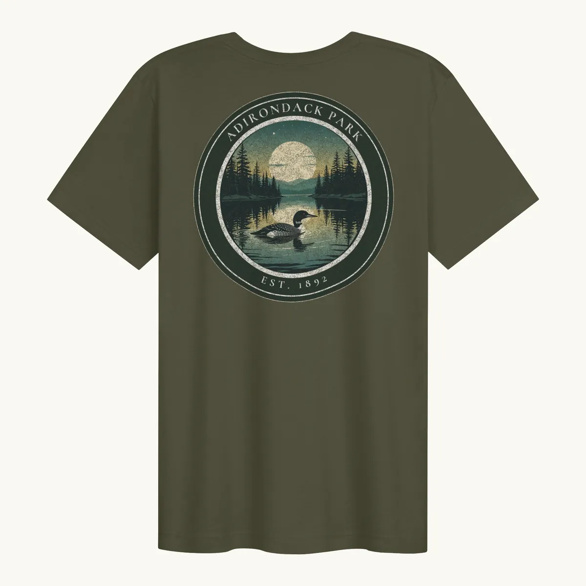 Loon at Night Tee in Military Green, back: a loon on a moonlit Adirondack lake in a round badge, Adirondack Park, Est. 1892.