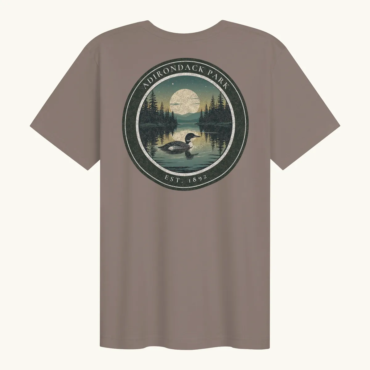 Loon at Night Tee in Pebble, back: a loon on a moonlit Adirondack lake in a round badge, Adirondack Park, Est. 1892.