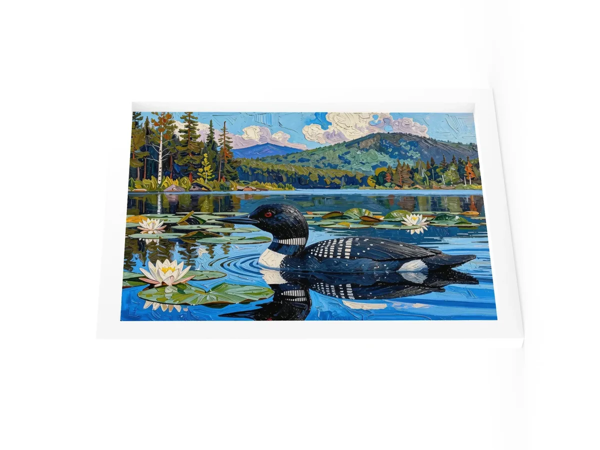 Loon in the Lily Pads as a 12 by 16 inch framed print in a white frame: a common loon swimming among lily pads and white water lilies on a blue Adirondack lake, in bold oil-painting brushstrokes.