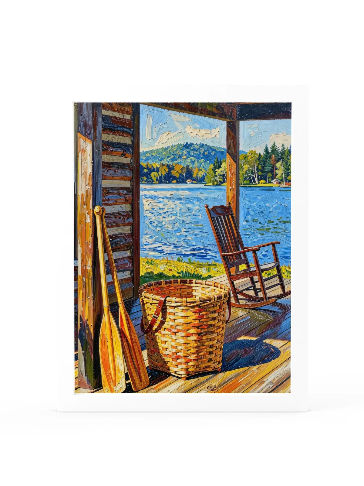The Camp Porch as a 12 by 16 inch framed print in a white frame: a camp porch with a woven pack basket, two canoe paddles against the log wall and an empty rocking chair facing the lake, in bold oil-painting brushstrokes.