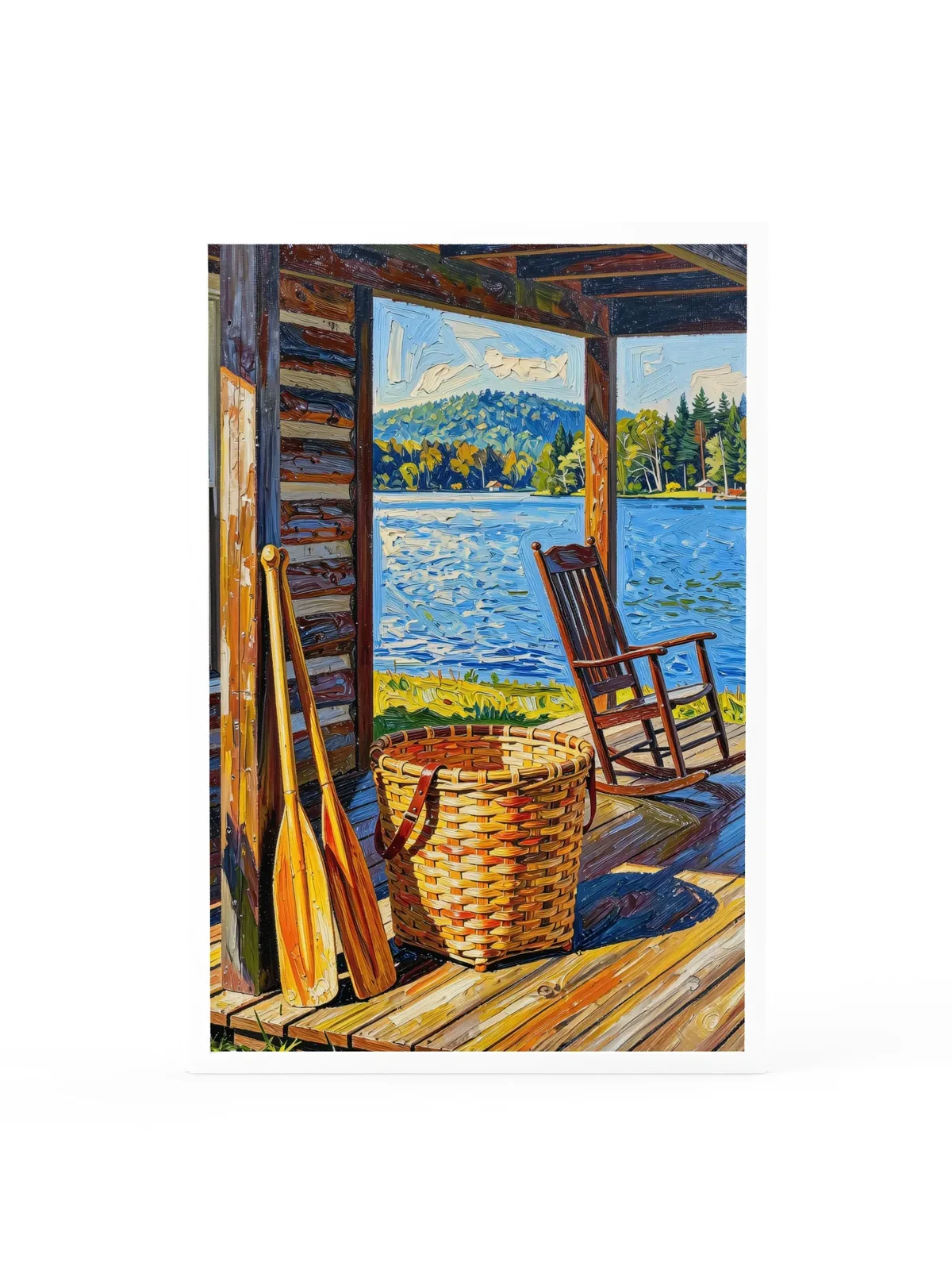 The Camp Porch as a 24 by 36 inch framed print in a white frame: a camp porch with a woven pack basket, two canoe paddles against the log wall and an empty rocking chair facing the lake, in bold oil-painting brushstrokes.