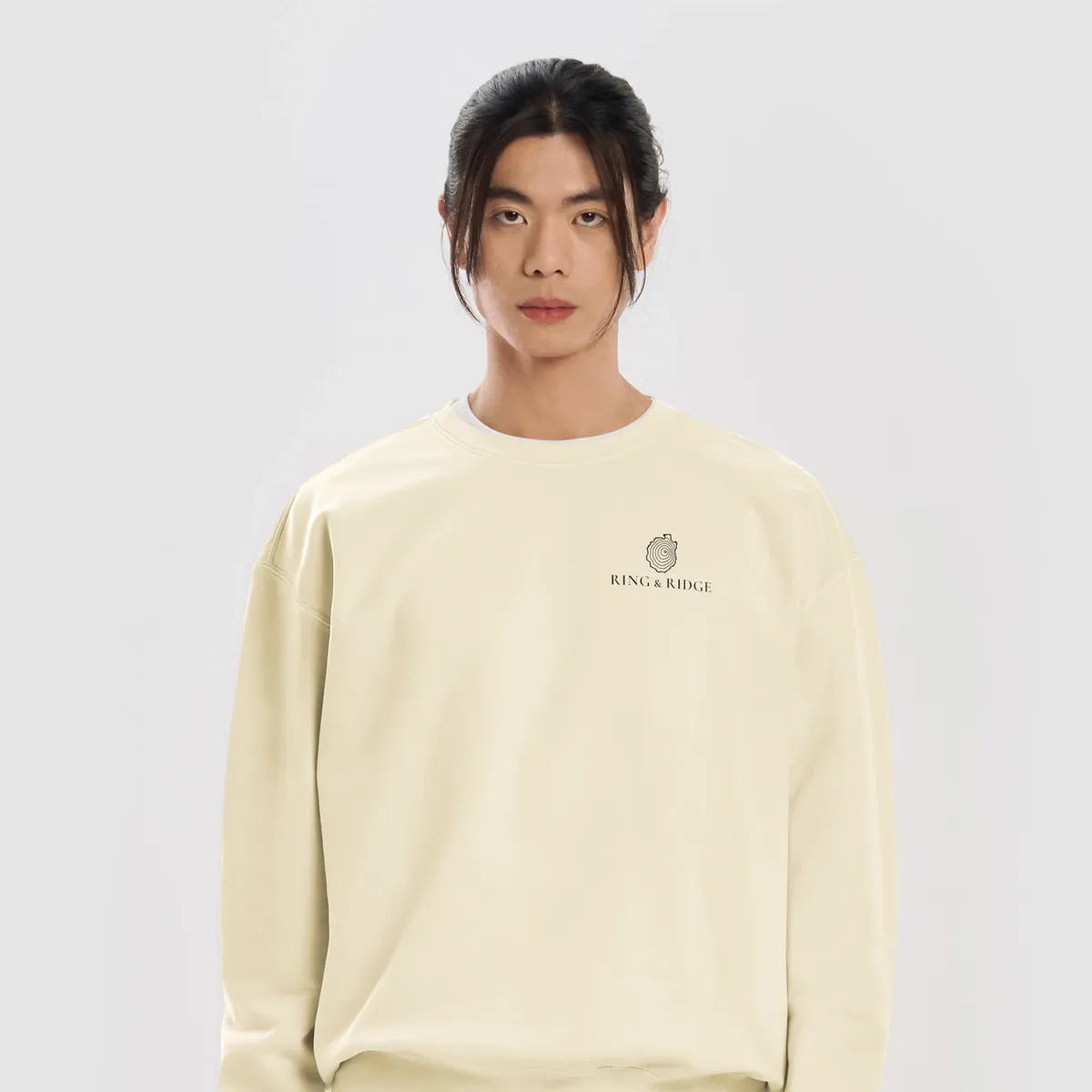 Tree Ring Crewneck in Ivory, front: the Ring & Ridge tree rings in the shape of the Adirondack Park.