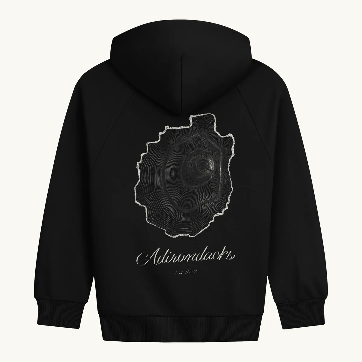 Tree Ring Hoodie in Black, back: the Ring & Ridge tree rings in the shape of the Adirondack Park.