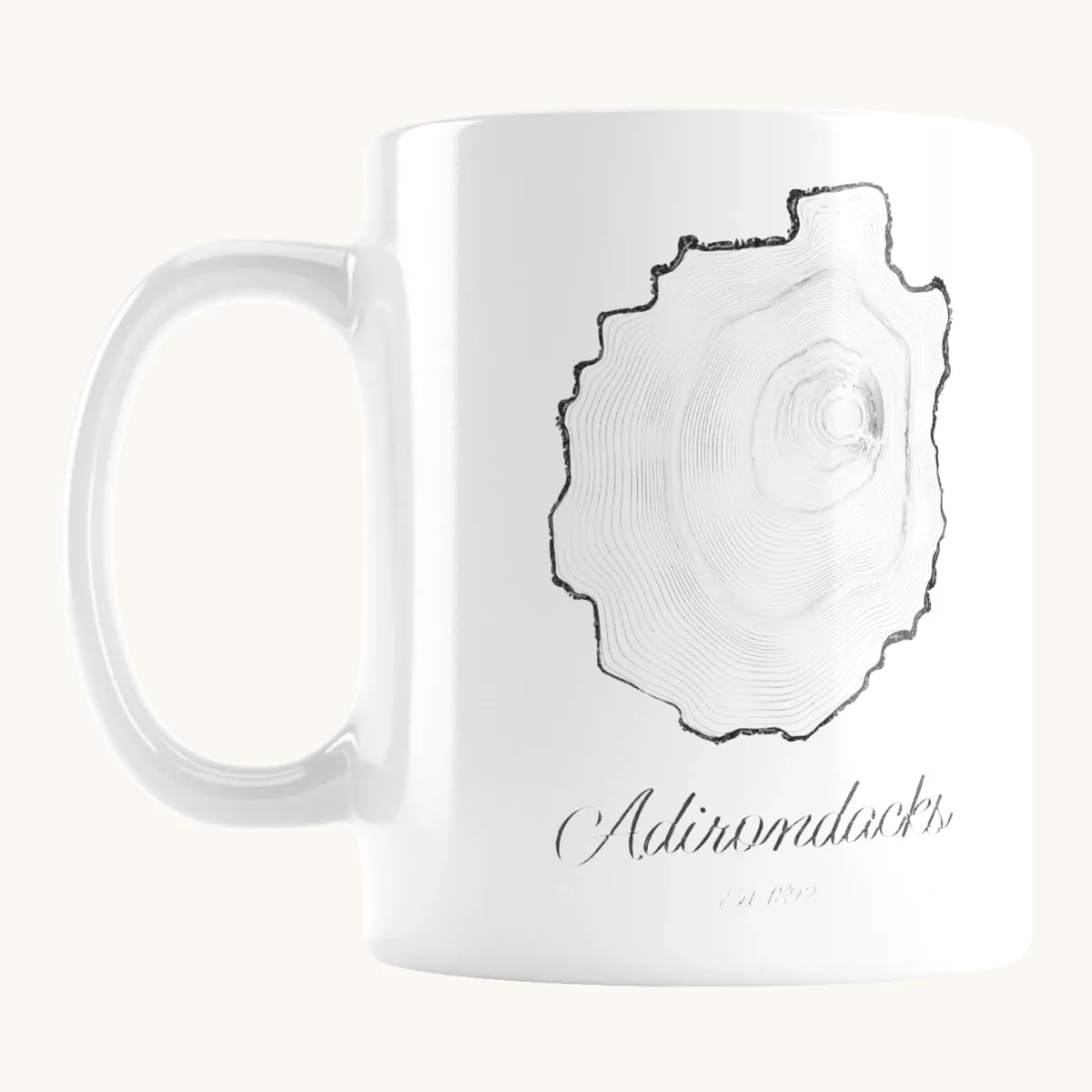 Tree Ring Mug: the Ring & Ridge tree rings in the shape of the Adirondack Park.
