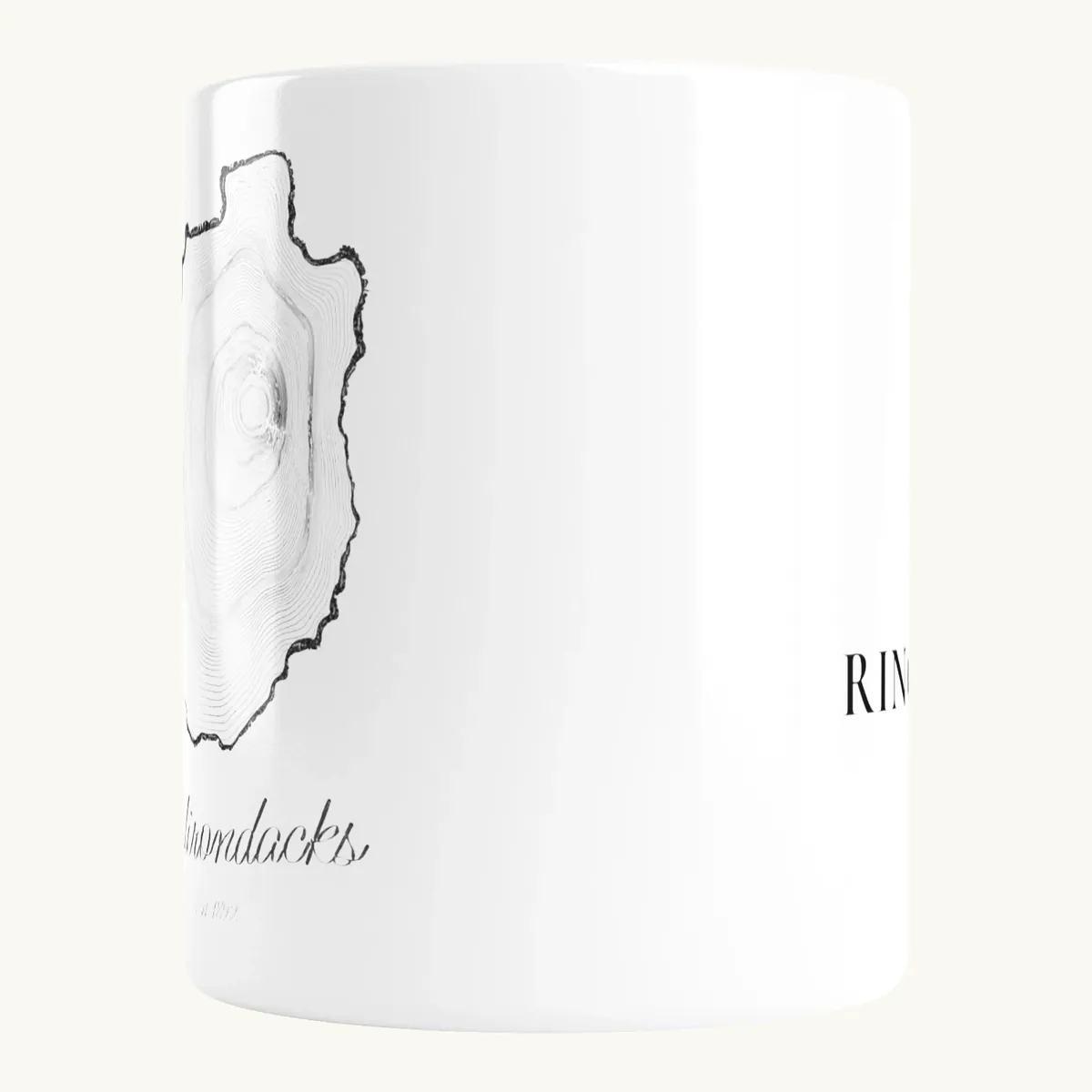 Tree Ring Mug: the Ring & Ridge tree rings in the shape of the Adirondack Park.