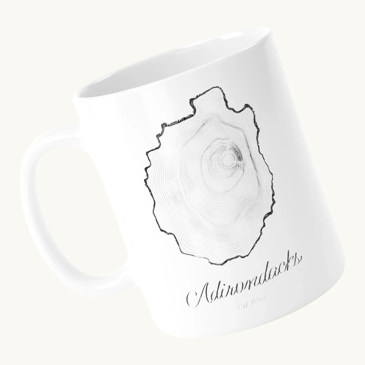 Tree Ring Mug: the Ring & Ridge tree rings in the shape of the Adirondack Park.