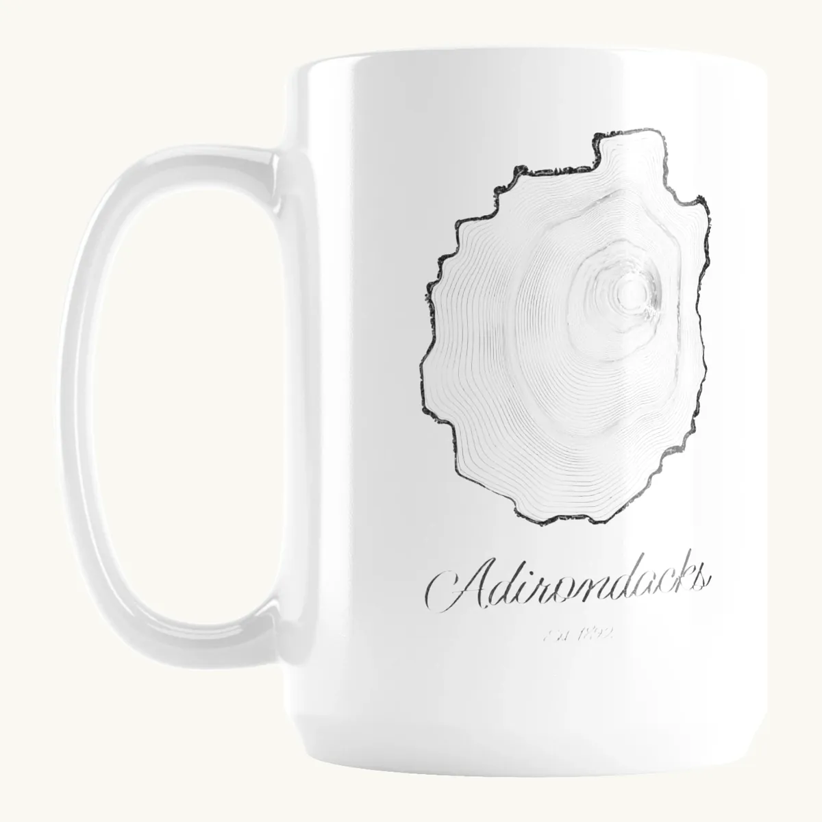 Tree Ring Mug: the Ring & Ridge tree rings in the shape of the Adirondack Park.