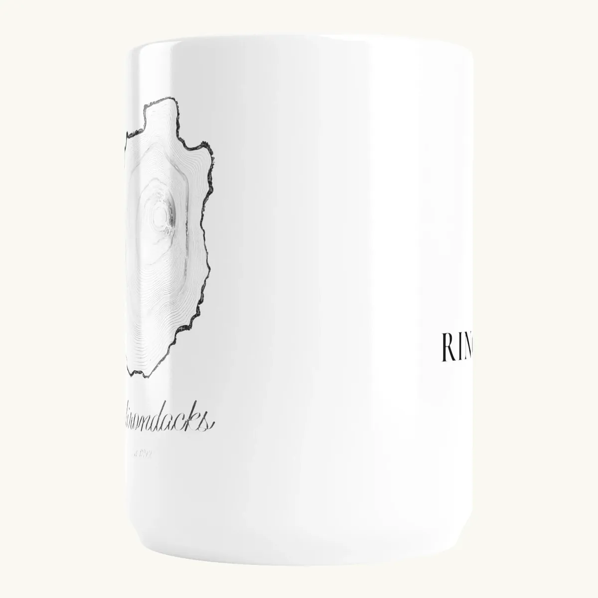 Tree Ring Mug: the Ring & Ridge tree rings in the shape of the Adirondack Park.