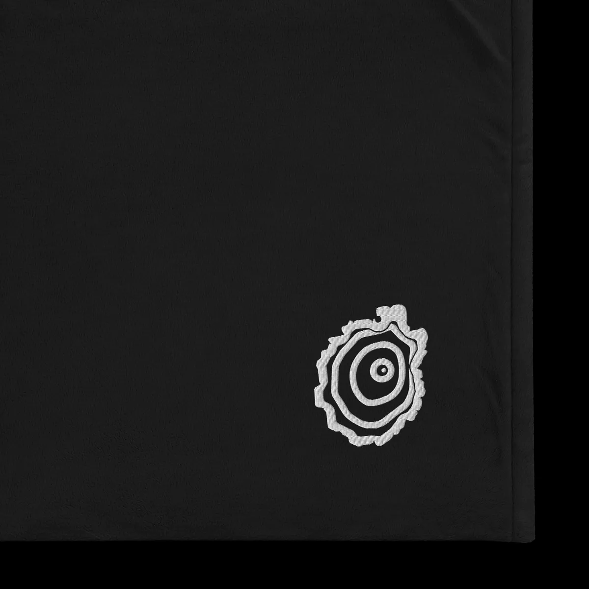Tree Ring Sherpa Blanket in Black, with the Ring & Ridge tree ring.