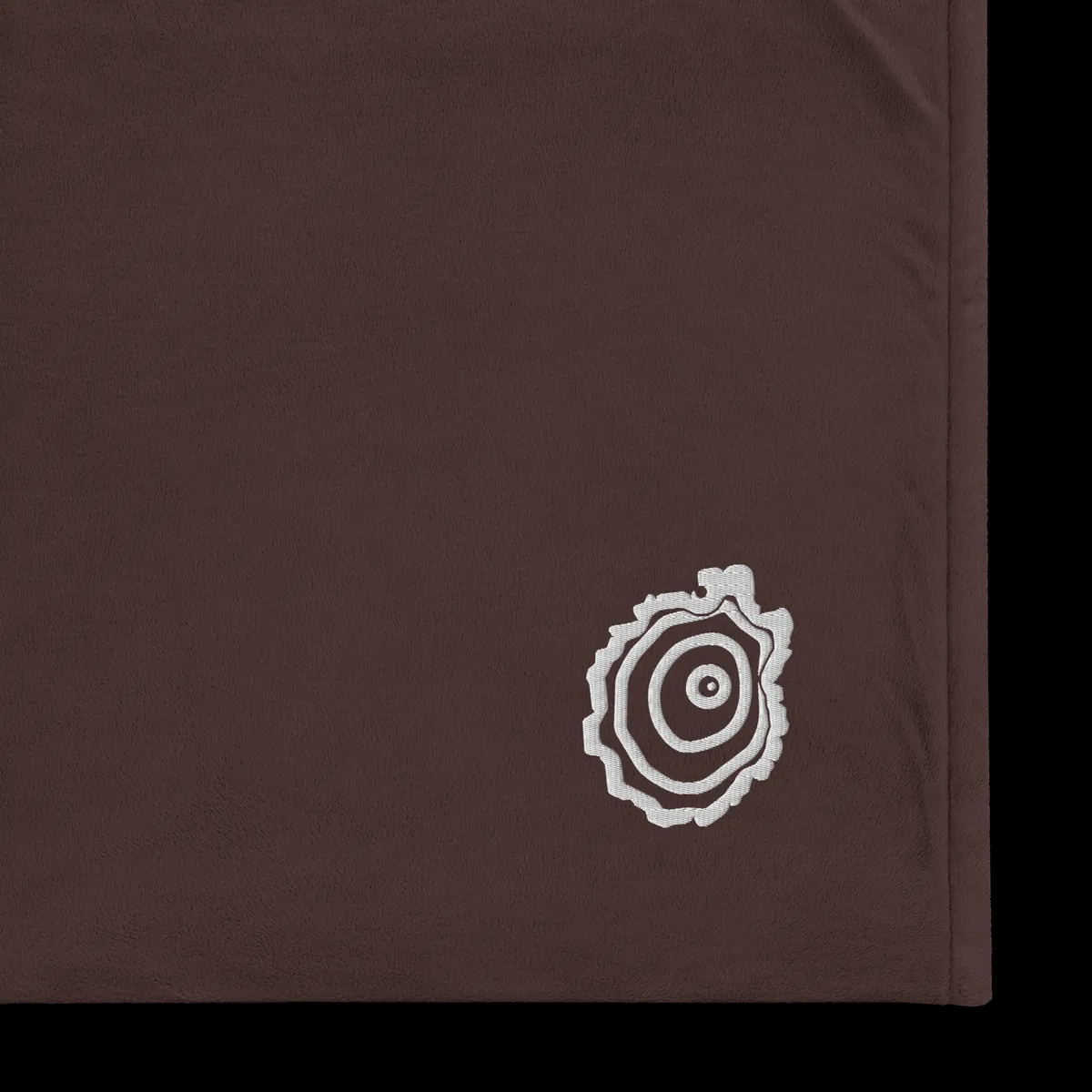 Tree Ring Sherpa Blanket in Fireside Brown, with the Ring & Ridge tree ring.
