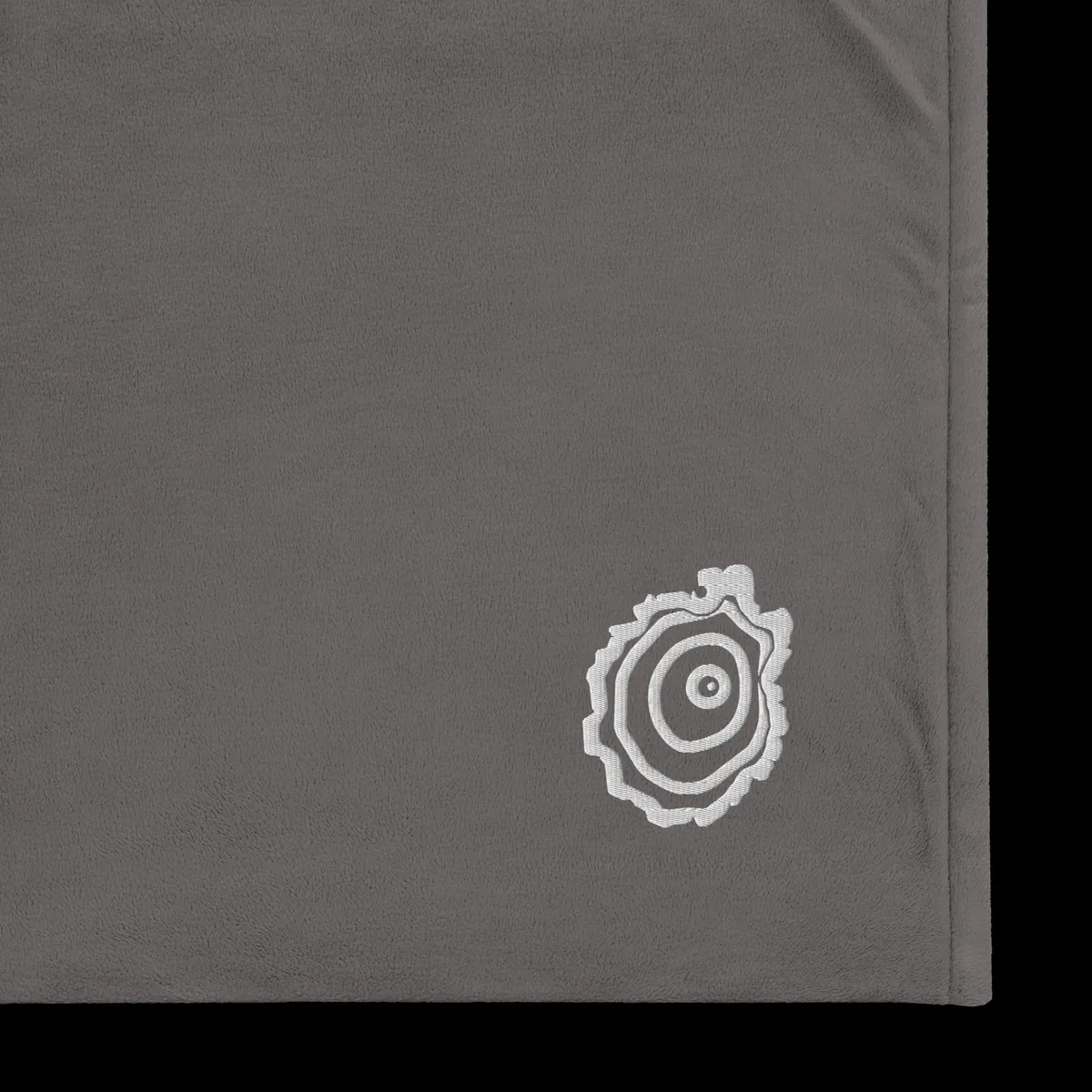 Tree Ring Sherpa Blanket in Heather Grey, with the Ring & Ridge tree ring.