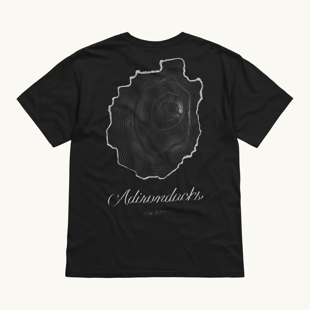 Tree Ring Tee in Black, back: the Ring & Ridge tree rings in the shape of the Adirondack Park.