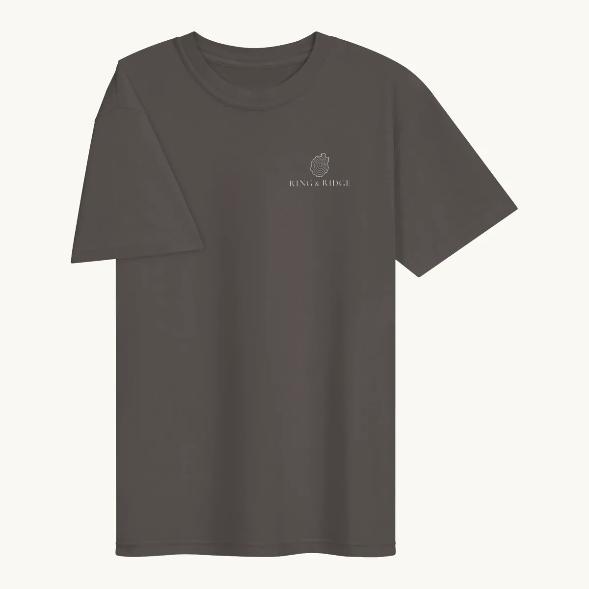 Tree Ring Tee in Pepper, front: the Ring & Ridge tree rings in the shape of the Adirondack Park.